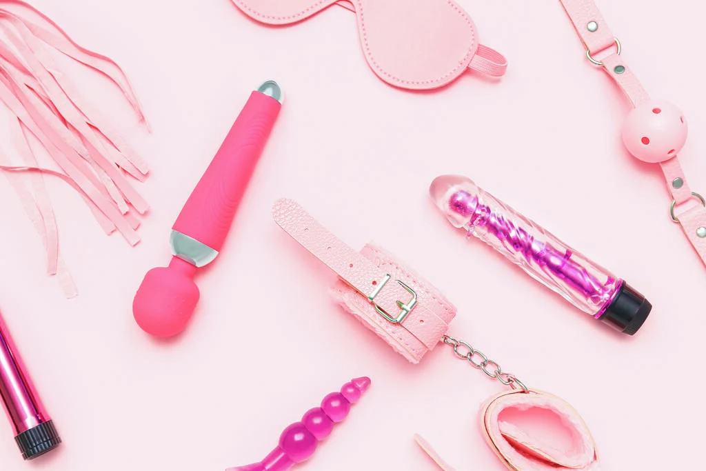 Some sex toys on a pink background