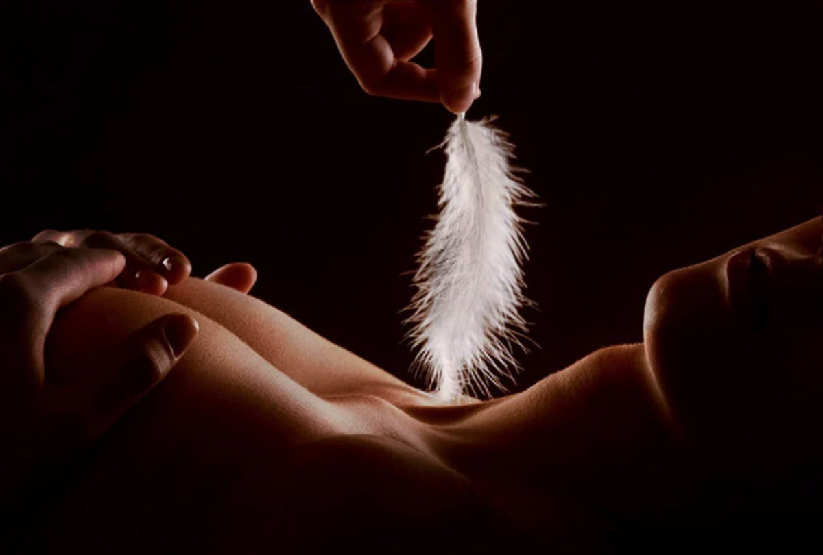 Feathers scratched the woman's neck