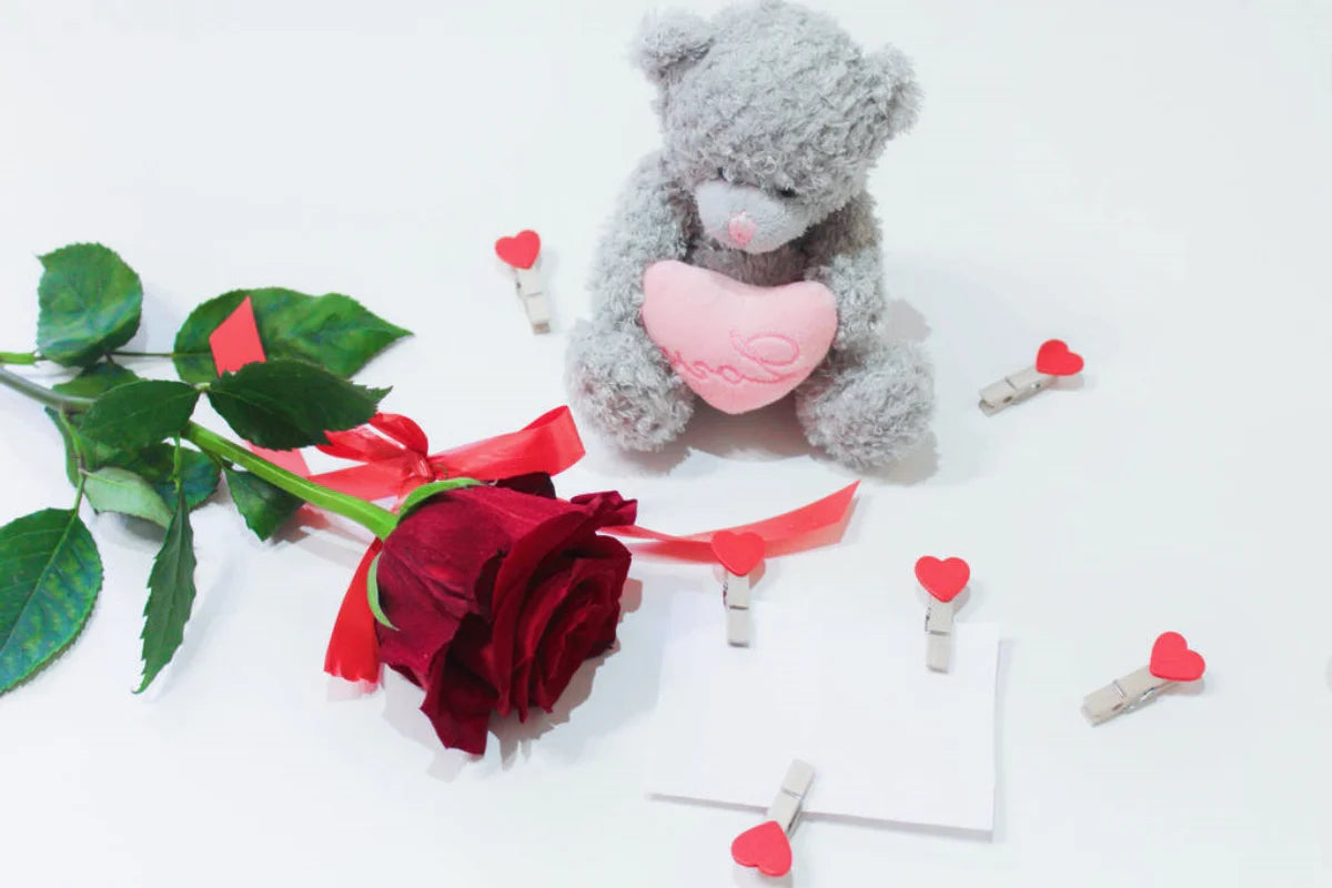 bear toy and rose