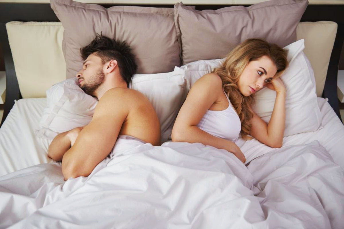 Couple having cold war in bed